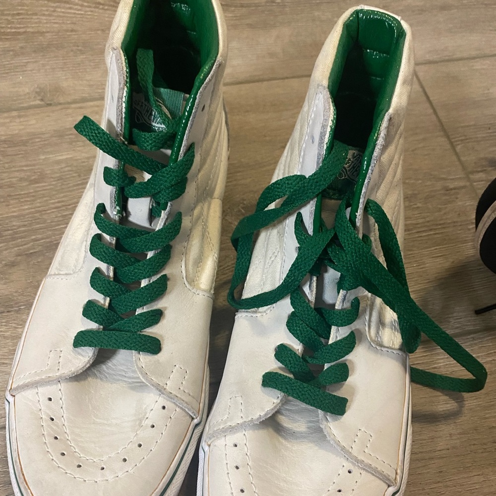 Vintage white high top vans with green accents. So cool and unique.